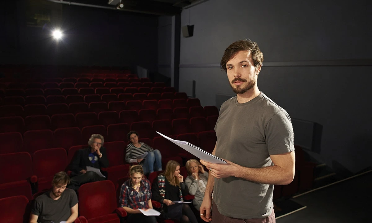 actor-holding-script-theater-rehearsal.webp