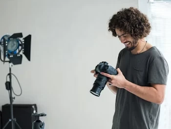 Accum man looking at his camera