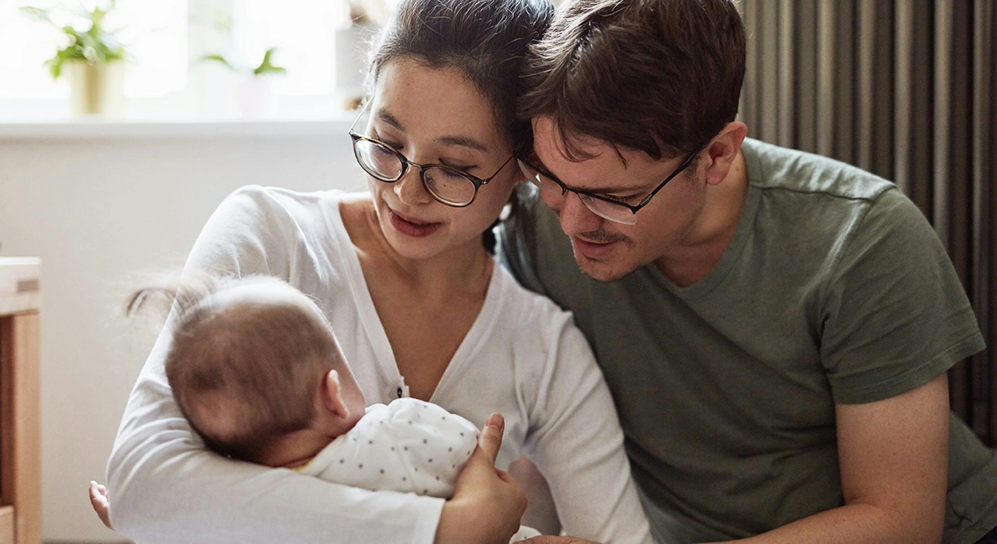 Accum couple looking at a baby